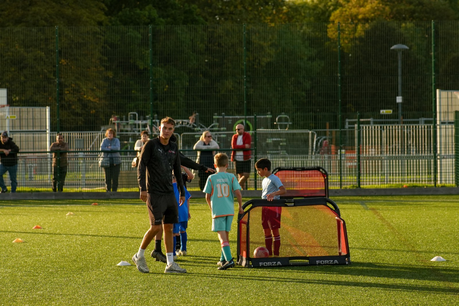 Kick On coaches running a session with young players